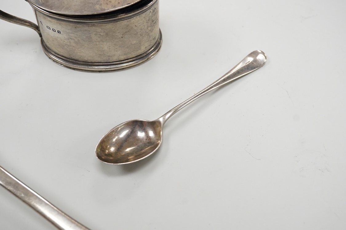 A William IV silver fiddle pattern table spoon by Richard Britton, London, 1834, together with a George V silver oval mustard pot, with blue glass liner, Edward Barnard Sons Ltd, London, 1931 and a silver coffee spoon.
